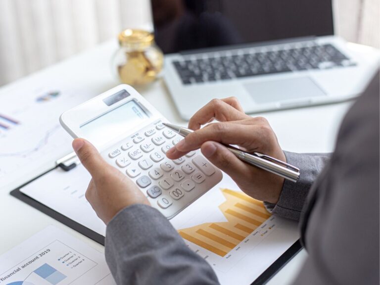 Financial consultant reviewing balance sheets and asset-based lending options to exit MCA debt