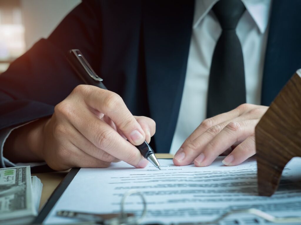 Financial advisor and business owner analyzing capital stack and refinancing options for MCA debt takeout