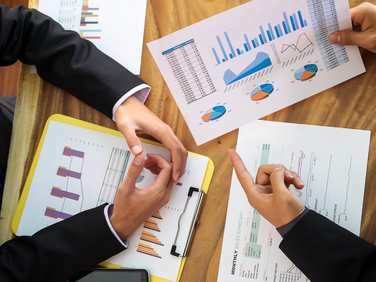 Financial advisor analyzing cash flow projections and debt service coverage ratios for MCA restructuring