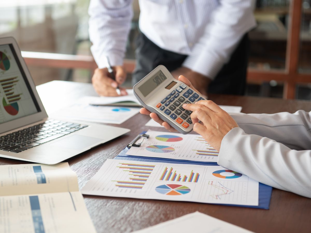 Business owner reviewing cash flow statements and merchant cash advance documents